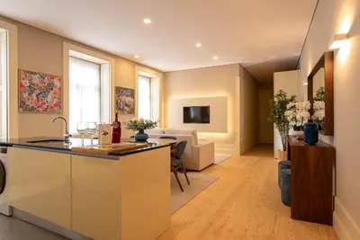 a kitchen and living room with a counter and a living room at CC Downtown Palace - G in Porto