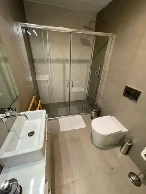 a bathroom with a shower and a toilet and a sink at CC Downtown Palace - H in Porto