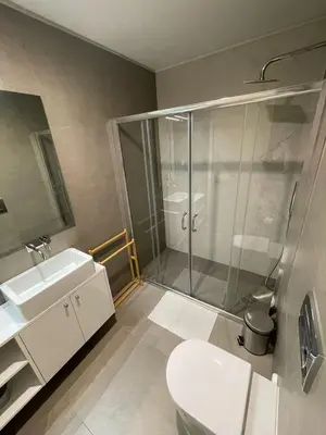 a bathroom with a shower and a toilet and a sink at CC Downtown Palace - H in Porto