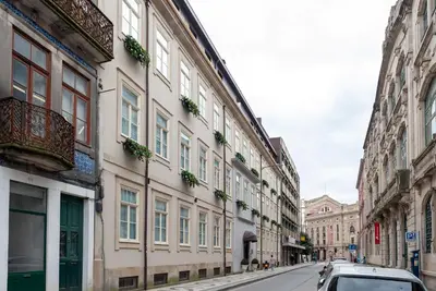 a car parked on a street next to buildings at CC Downtown Palace - H in Porto