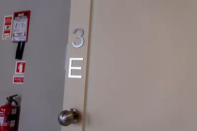 a white refrigerator with the number three on it at CC Downtown Palace - I in Porto