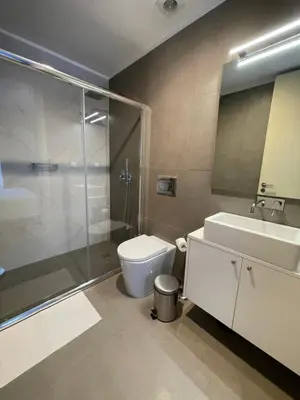 a bathroom with a toilet and a shower and a sink at CC Downtown Palace - J in Porto