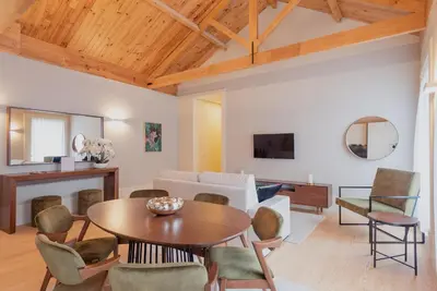 a living room with a table and chairs at CC Downtown Palace - J in Porto