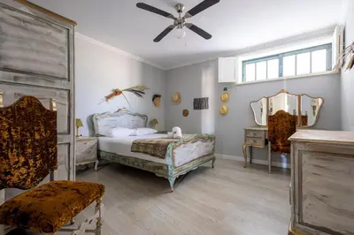 a bedroom with a bed and a ceiling fan at MyRiverPlace River View Porto apartments in Vila Nova de Gaia