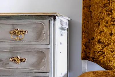 a silver dresser with gold knobs on it at MyRiverPlace River View Porto apartments in Vila Nova de Gaia