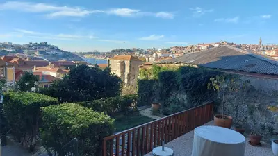 a view of a city from a balcony at MyRiverPlace River View Porto apartments in Vila Nova de Gaia