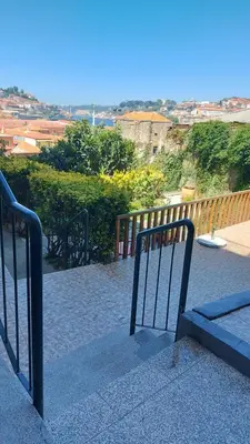 a metal gate on a balcony with a view at MyRiverPlace River View Porto apartments in Vila Nova de Gaia