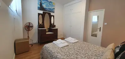 a bedroom with a bed with two towels on it at SantOporto Clérigos in Porto
