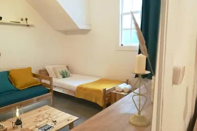 a small room with a bed and a table at Rian - central 2 bedroom Apartment in Porto in Porto