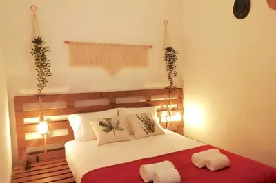 a bedroom with a bed with two towels on it at Rian - central 2 bedroom Apartment in Porto in Porto
