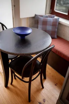 a black table with a blue bowl on top of it at Bolhão - Dixo's Oporto Apartments VIII in Porto