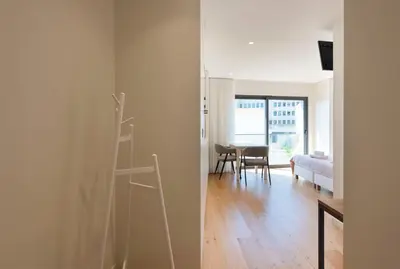 a room with a ladder and a room with a bedroom at LovelyStay - Heart of D. Pedro Apartments IV in Porto
