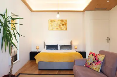 a bedroom with a bed and a couch at Villa Invicta in Porto