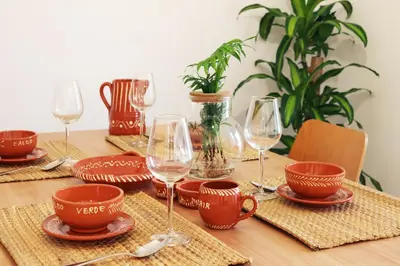 a table with wine glasses and plates on it at Villa Invicta in Porto