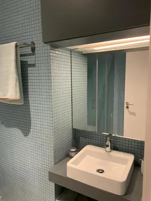 a bathroom with a sink and a mirror at Palace House Apartment in Porto