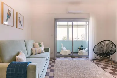 a living room with a couch and a rug at D&S - Family Apartments I in Porto