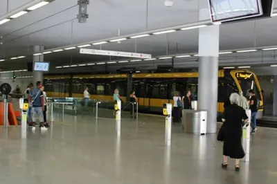 a group of people waiting for a train at a train station at Romantic Getaway Suite in Porto