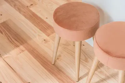 a pair of pink chairs sitting on a wooden floor at GuestReady - Three Mirrors in Porto