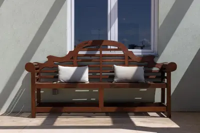 a wooden bench sitting in front of a window at Best rooftop in Porto! in Porto