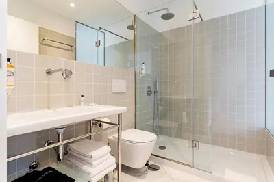 a bathroom with a sink toilet and a shower at Casa de Arouca Porto Apartments in Porto