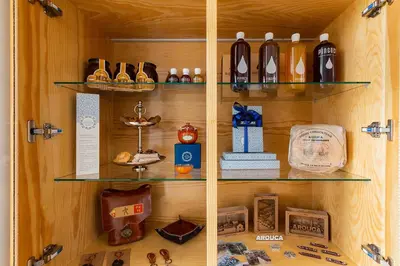 a wooden shelf with various items on it at Casa de Arouca Porto Apartments in Porto