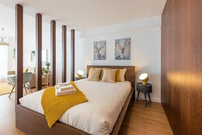 a bedroom with a large bed in a room at GuestReady - Hemisphere Apt in Porto