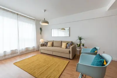 a living room with a couch and a table at GuestReady - Hemisphere Apt in Porto
