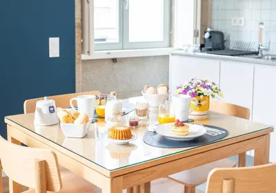 a table with breakfast foods on it in a kitchen at Mouzinho da Silveira Unique Apartments, by Oporto Collection in Porto