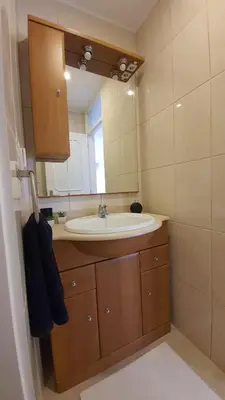 a bathroom with a sink and a mirror at Gaiapart in Vila Nova de Gaia