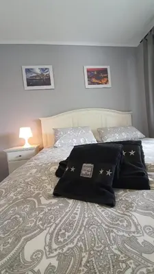 a bedroom with a bed with pillows on it at Gaiapart in Vila Nova de Gaia