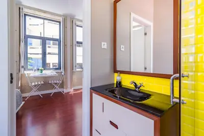 a bathroom with a sink and a mirror at ON Apartments - Center in Porto