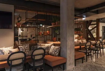 a dining room with a table and chairs at Fontinha Porto, Trademark Collection by Wyndham in Porto