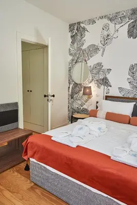 a bedroom with a bed with a red blanket at BOUTIQUE Rentals-Flores Classic historical centre in Porto