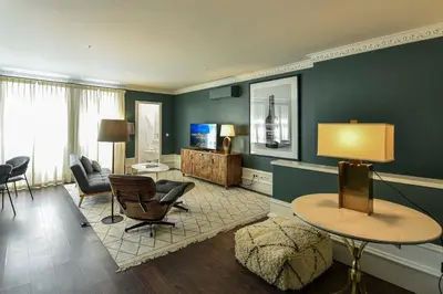 a living room with a couch and a window at Almada 234 in Porto