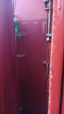 a bathroom with a red stall with a shower at AL-Pinheiro 62 in Porto