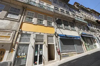 an old building with windows and a balcony at FLH Porto Traditional Studio with Terrace in Porto