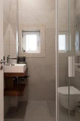 a bathroom with a sink and a toilet and a mirror at GuestReady - The Dukes Retreat E in Porto