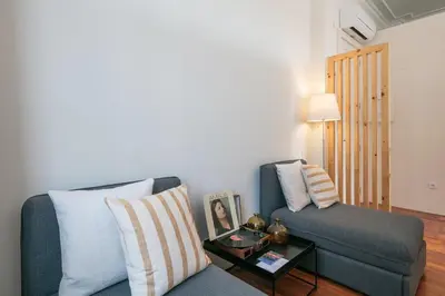 a living room with a couch and a table at Oportments - S.Bento in Porto