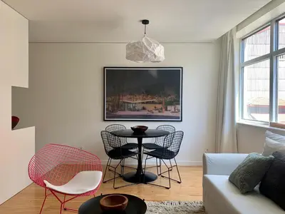 a living room with a table and chairs at Oporto Chic & Cozy - Santa Catarina in Porto