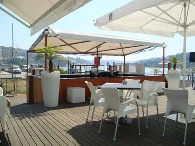 a bed with towels and wine glasses and flowers on it at Douro4sailing in Porto