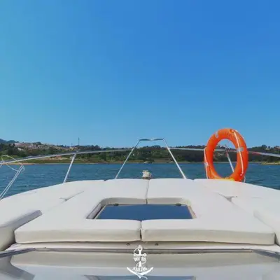 a person standing on a boat with a shirt that sayswine bowling at Douro4sailing in Porto