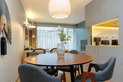 a bedroom with a bed and a view of a balcony at Feel Porto Corporate Housing Campanhã in Porto