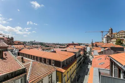an aerial view of a city with roofs at Newly Renovated Cozy Central Loft w/ AC by LovelyStay in Porto
