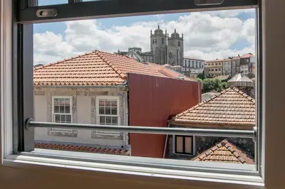 a view of a city from a window at Newly Renovated Cozy Central Loft w/ AC by LovelyStay in Porto