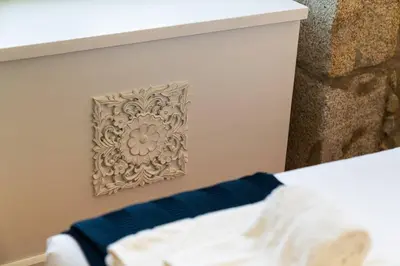 a close up of a bed with a wall at Casa Nina in Porto