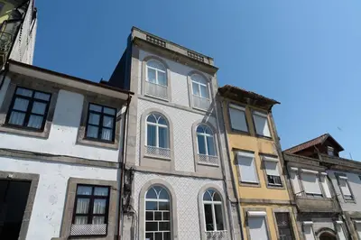 a row of older buildings in a city at Joy Porto in Porto