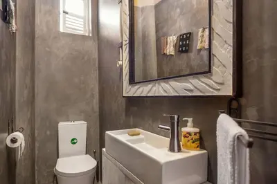 a bathroom with a sink and a toilet and a mirror at VIVA Fabulous Old World in Porto