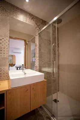 a bathroom with a sink and a shower at Lemago Porto Apartments - Poveiros in Porto