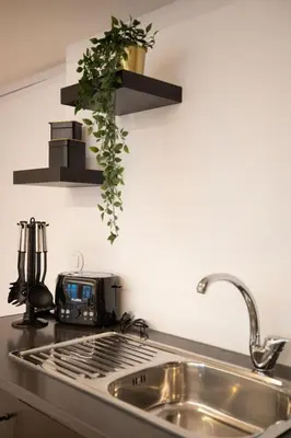 a kitchen counter top with a sink and a sink at Lemago Porto Apartments - Poveiros in Porto