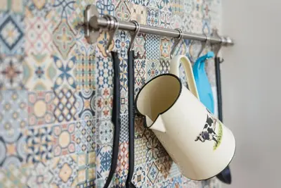 a hairdryer hanging on a wall at GuestReady - Cityscape coastal flat in Porto